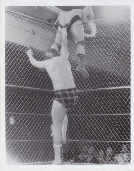 1980s Portland Wrestling "Rowdy" Roddy Piper vs. Playboy Buddy Rose (Cage) Vintage Promo Photo