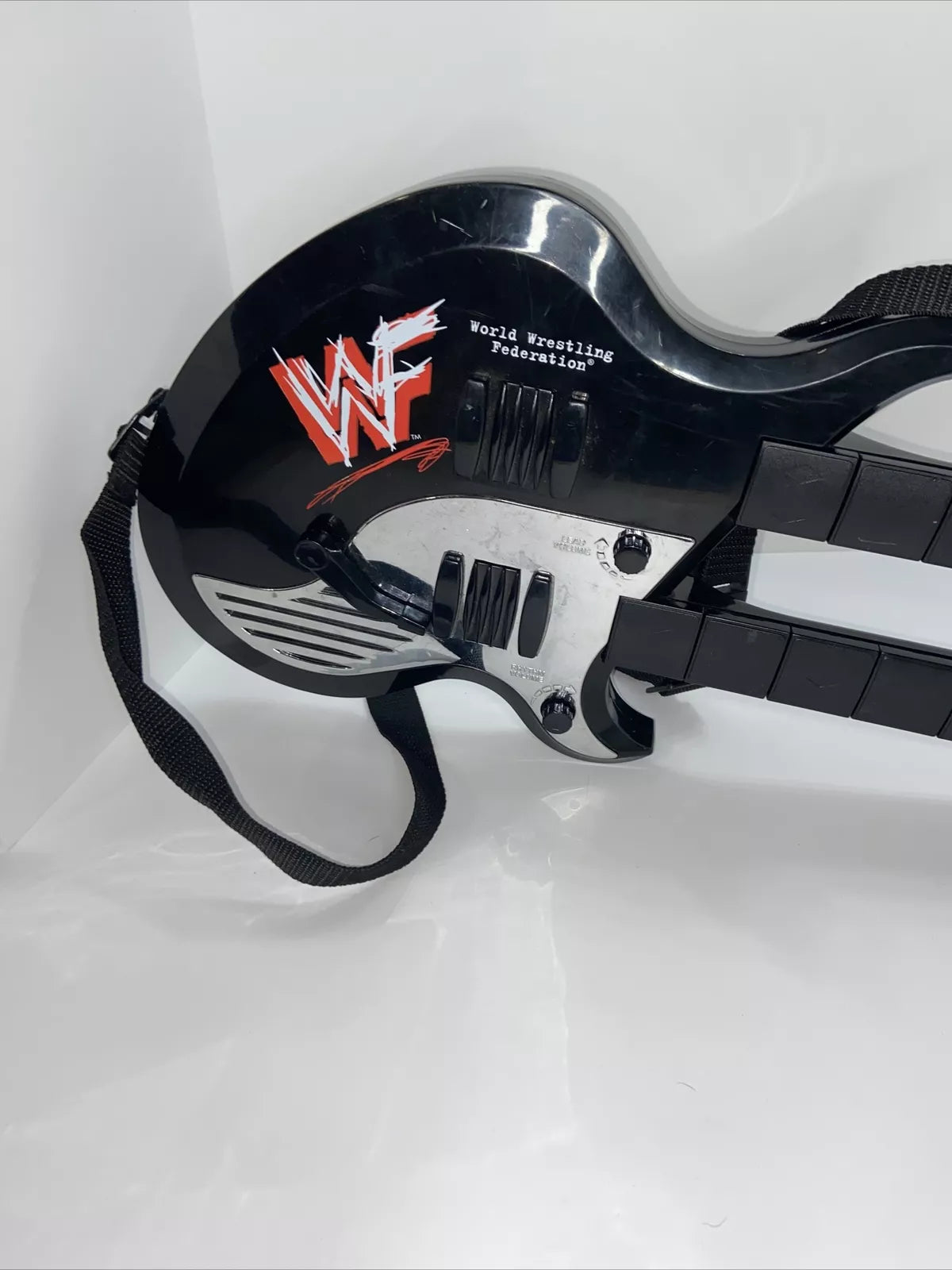 WWF Double Neck Guitar 1999 by DSI Toys PWcatalog
