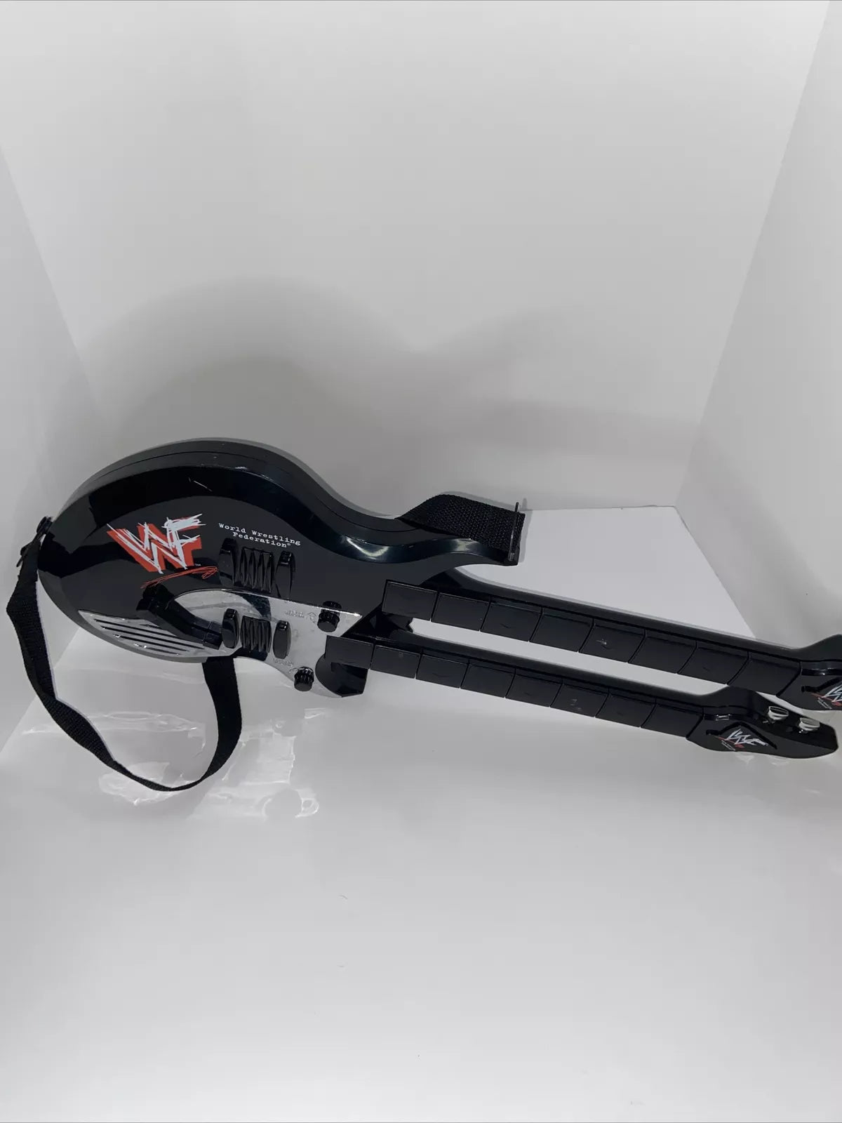 WWF Double Neck Guitar 1999 by DSI Toys PWcatalog