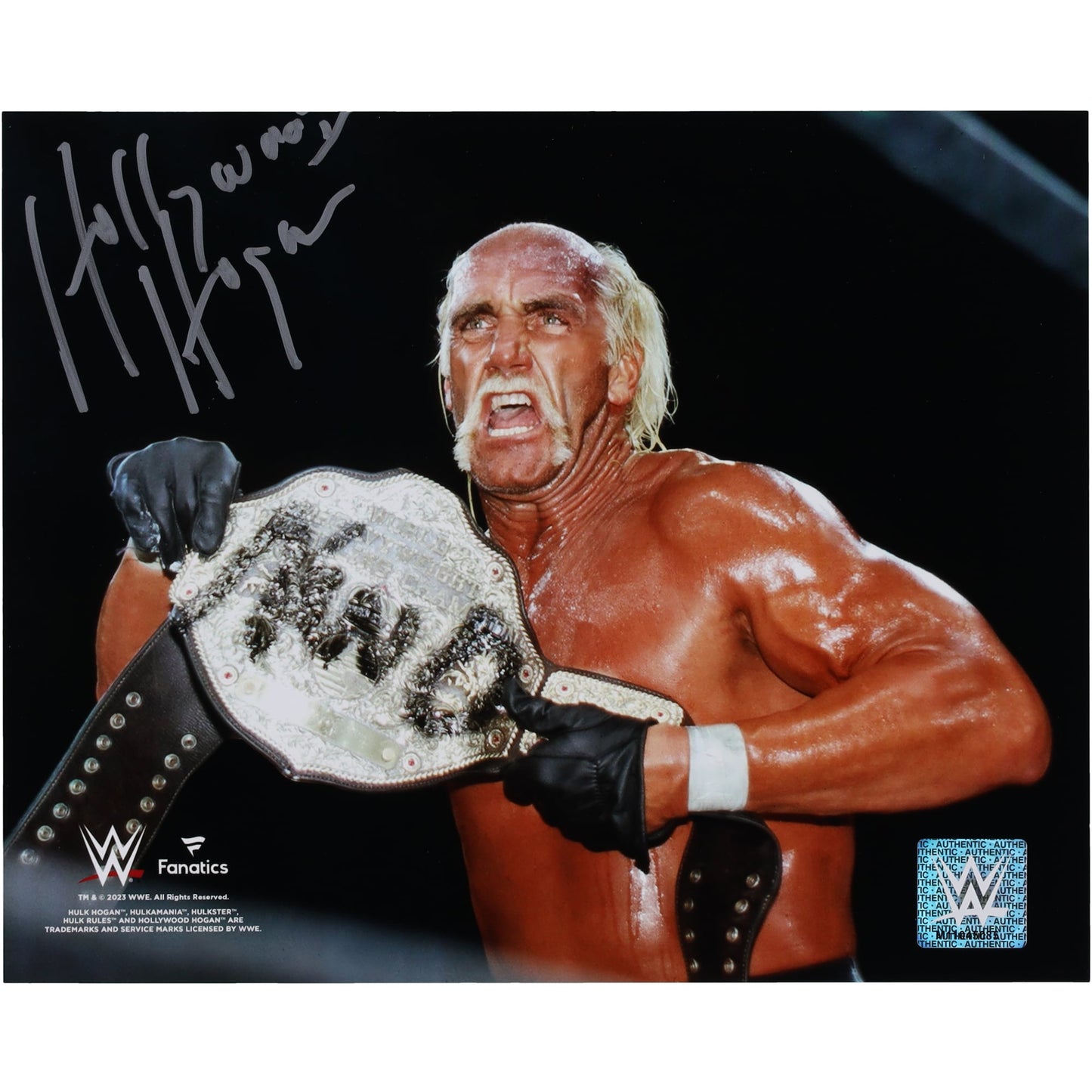 Hulk Hogan WWE Autographed 8" x 10" Holding New World Order Title Photograph