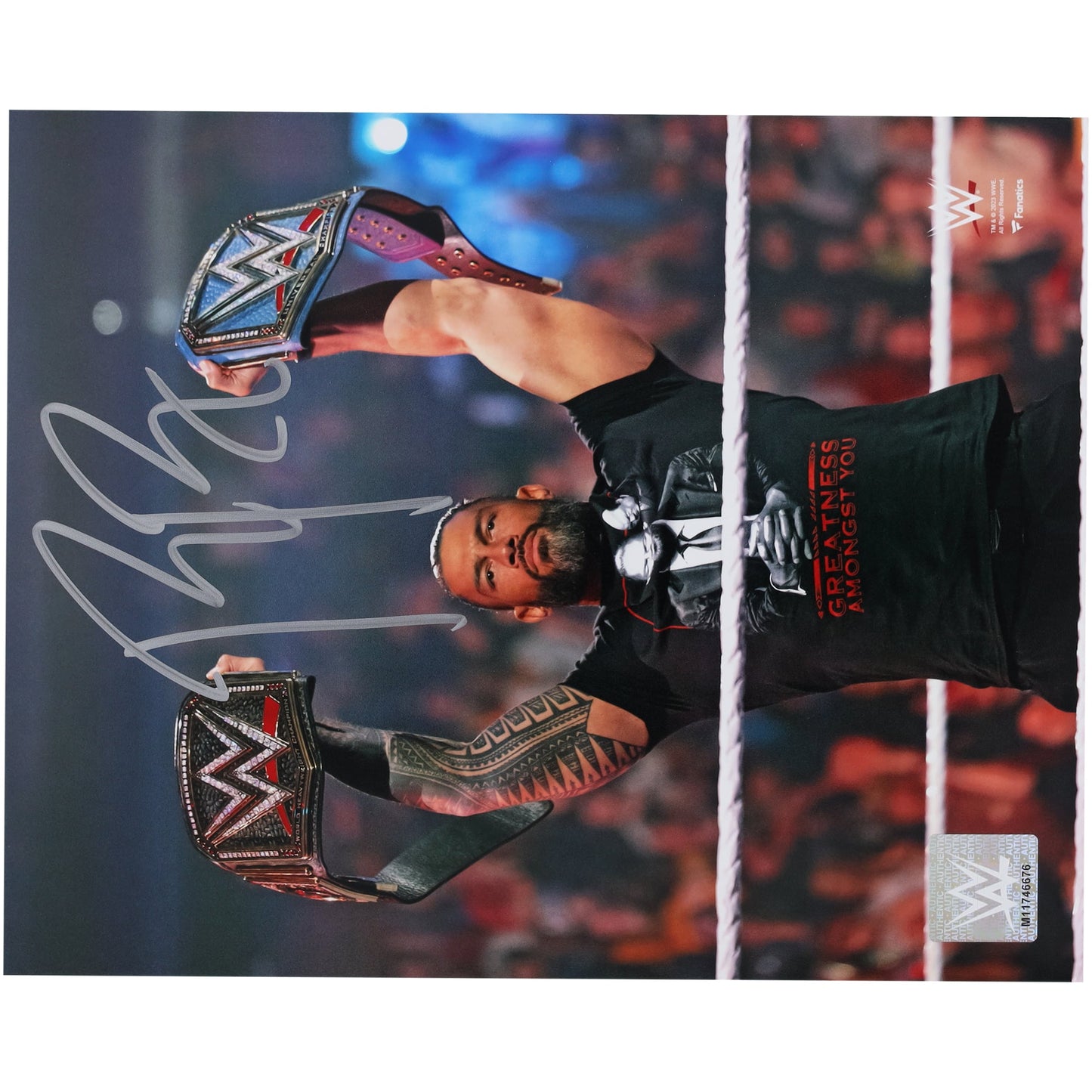 Roman Reigns WWE Autographed 8" x 10" Raising Titles Photograph