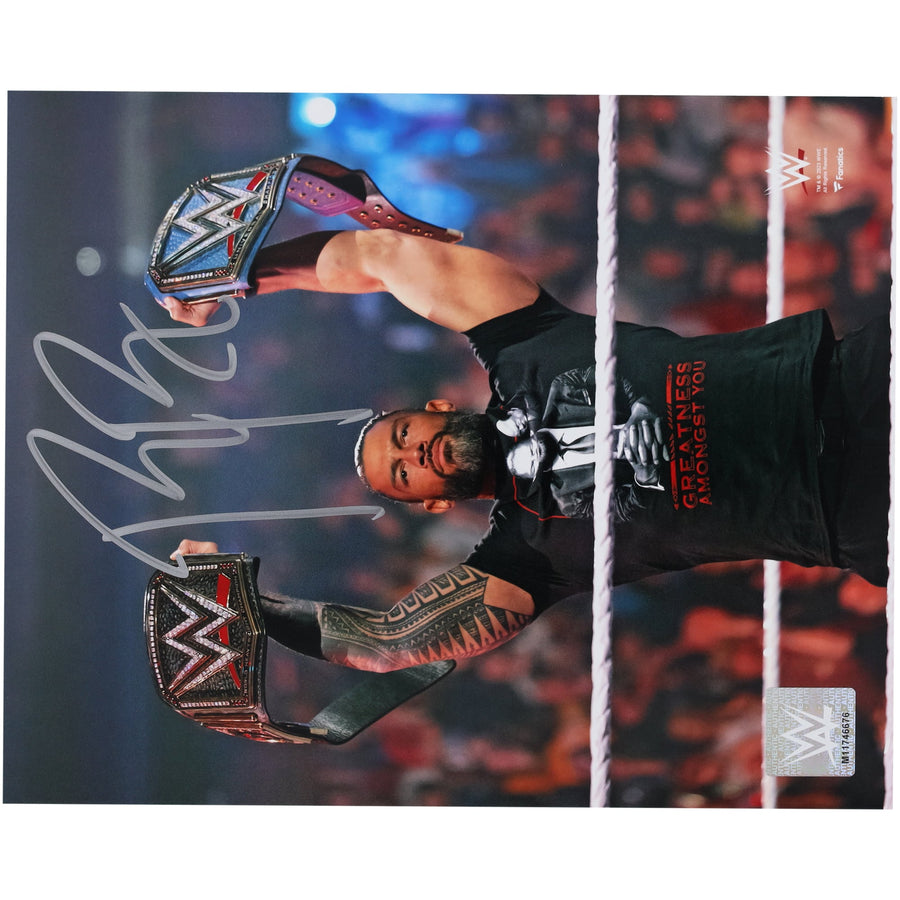 Roman Reigns WWE Autographed 8" x 10" Raising Titles Photograph
